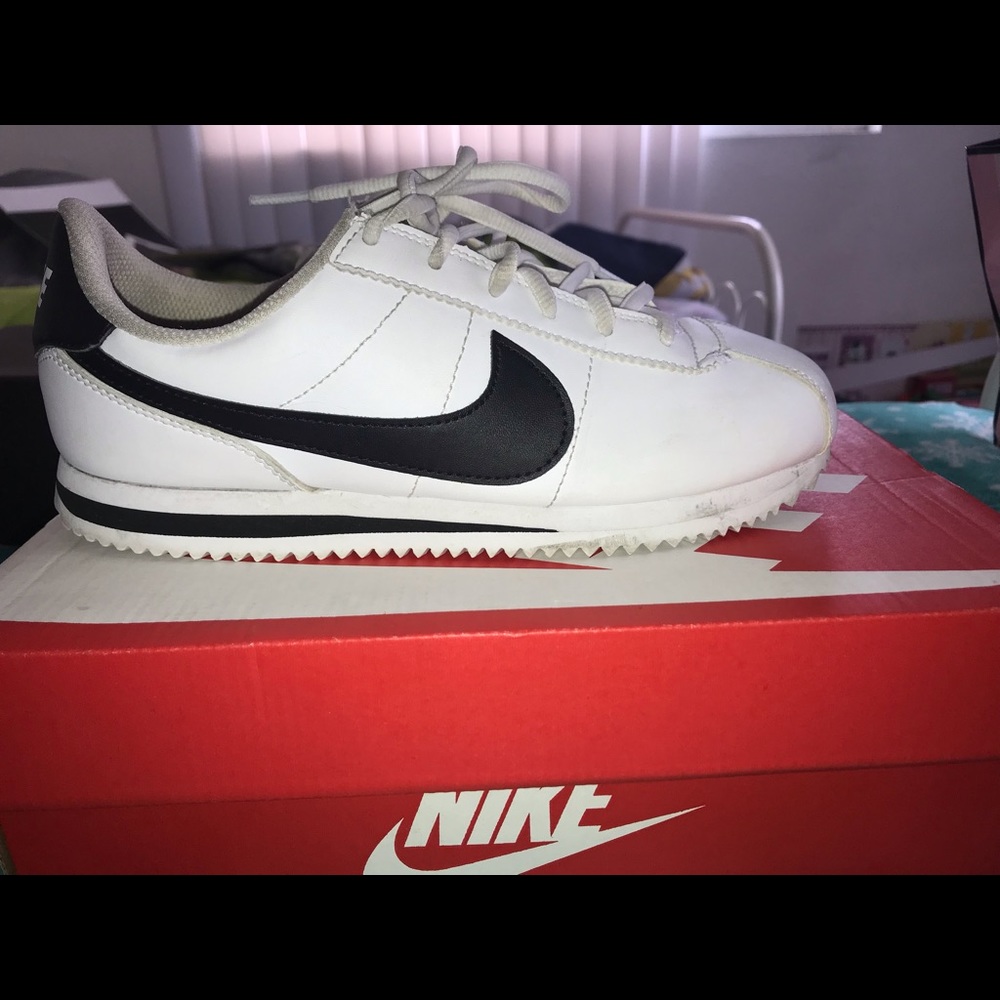 white and black nike cortez